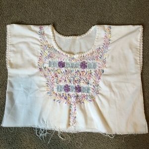 woman's white top with embroidery